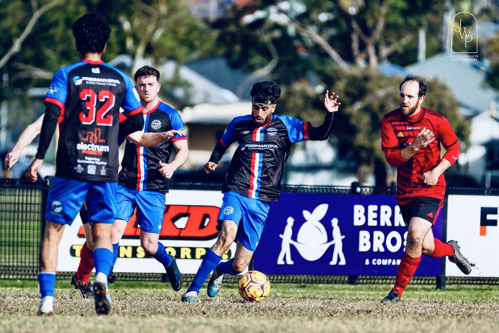 Mustafa dribbling in an action shot playing for Stockton Sharks FC vs Newcastle Suns FC at Myers Park